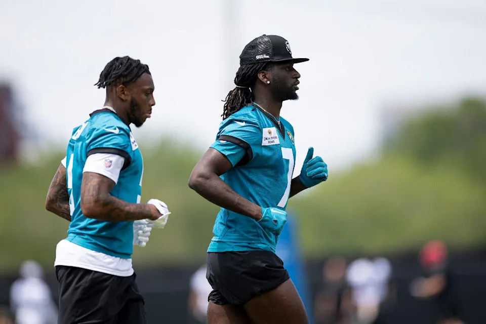 Jacksonville Jaguars wide receiver Brian Thomas Jr. (7) and Dyami Brown (5) jog during voluntary minicamp in April, 2025.