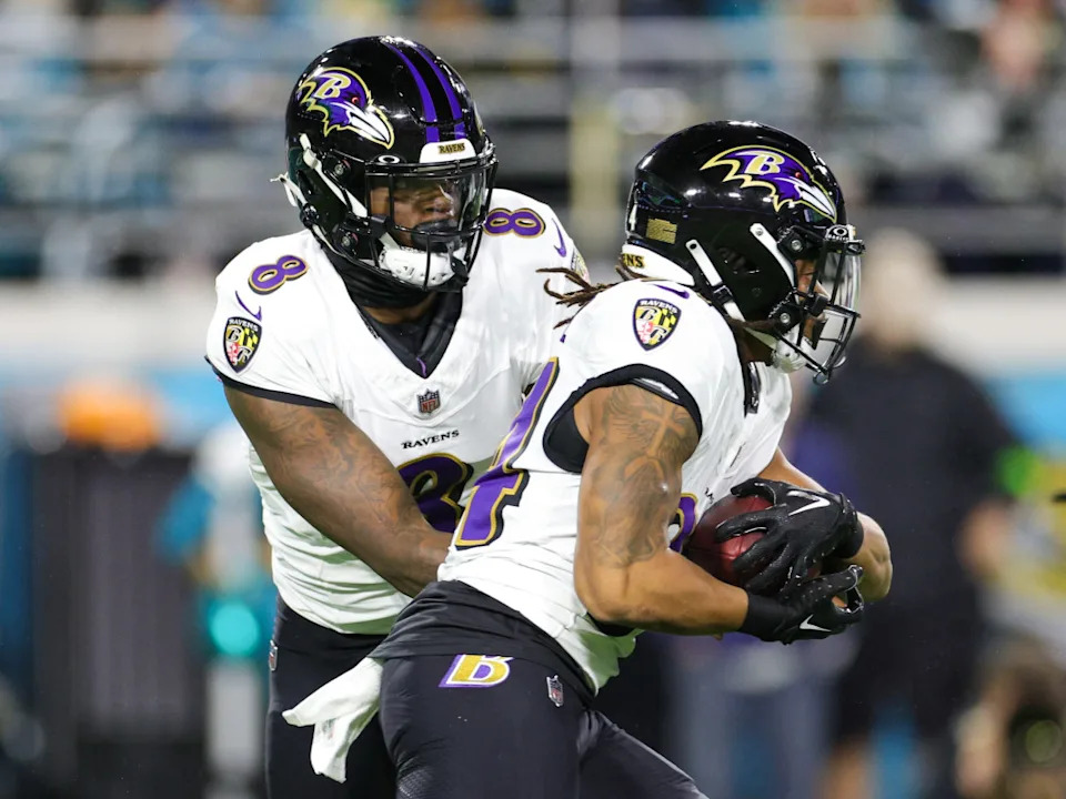 Keaton Mitchell gets a handoff from Lamar Jackson.Nathan Ray Seebeck-Imagn Images