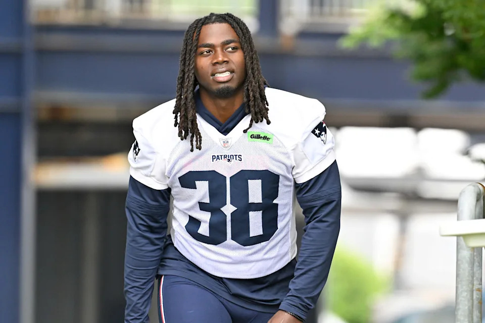 Jun 9, 2025; Foxborough, MA, USA; New England Patriots running back Rhamondre Stevenson (38) walks to the practice fields at Gillette Stadium. Mandatory Credit: Eric Canha-Imagn Images