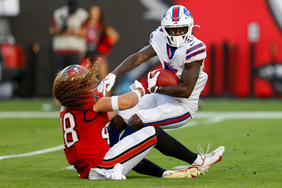 Dec 12, 2021; Tampa, Florida, USA; Buffalo Bills wide receiver Marquez Stevenson (5) is tackled by Tampa Bay Buccaneers linebacker Grant Stuard (48) in the first half at Raymond James Stadium. Mandatory Credit: Nathan Ray Seebeck-USA TODAY Sports