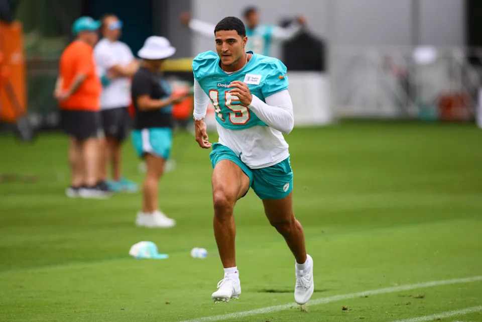 Miami Dolphins linebacker Jaelan Phillips (15) works out during training camp at Baptist Health Training Complex.Sam Navarro-Imagn Images