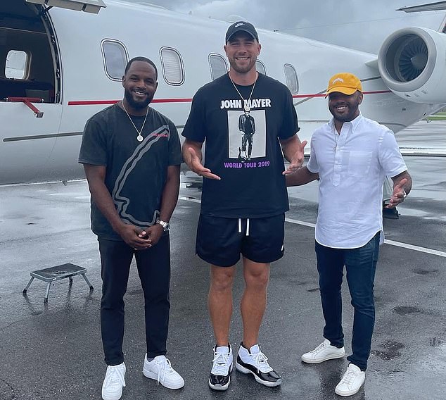 Kelce alongside his agents, Andre and Aaron Eanes, who announced their move on Monday