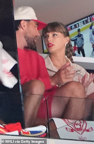 Kelce opted for a red sweater and shorts combo