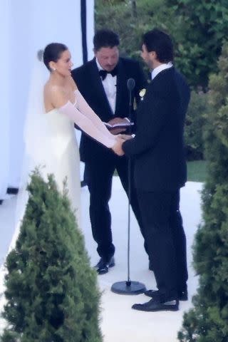 BACKGRID Hailee Steinfeld and Josh Allen hold hands during their wedding ceremony