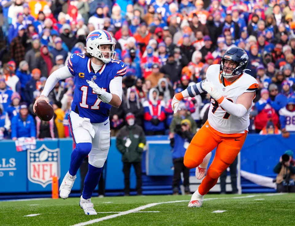 Buffalo Bills quarterback Josh Allen (17) runs for a gain during the fourth quarter as Denver Broncos defensive end Zach Allen (99) defends in an AFC wild card game at Highmark Stadium.Gregory Fisher-Imagn Images