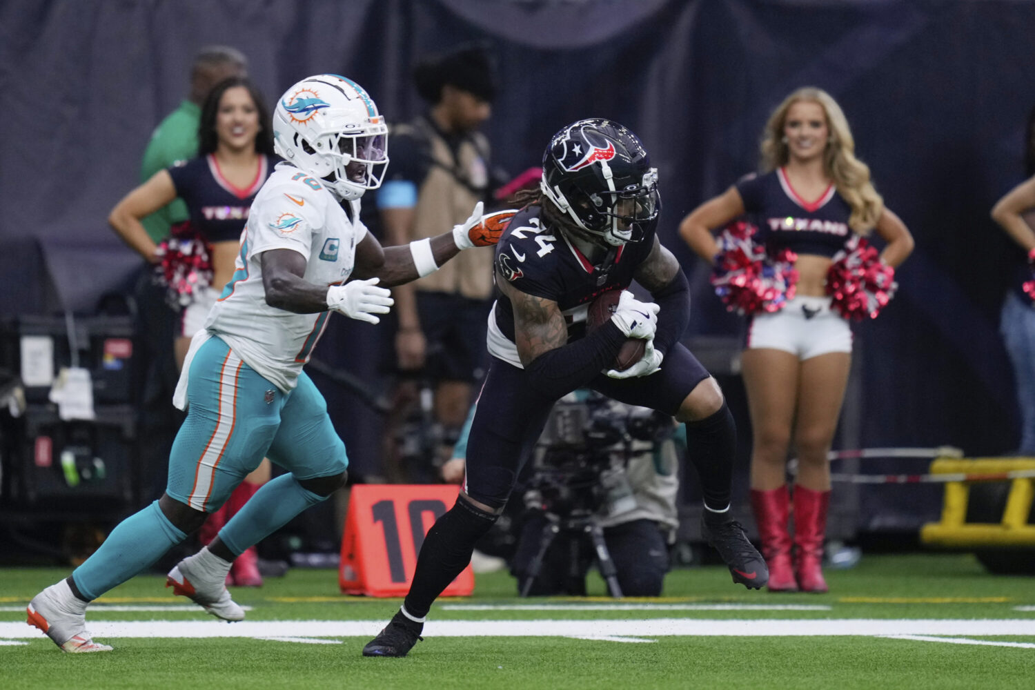 Houston Texans cornerback Derek Stingley Jr. (24) intercepts a pass intended for Miami Dolphins wide receiver Tyreek Hill (10) during the second half of an NFL football game Sunday, Dec. 15, 2024, in Houston.