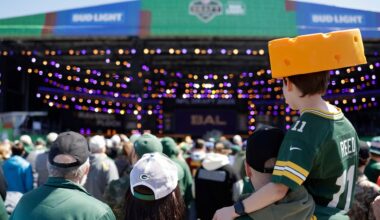 Fans watch during the third day of the NFL football draft, Saturday, April 26, 2025, in Green Bay, Wis.