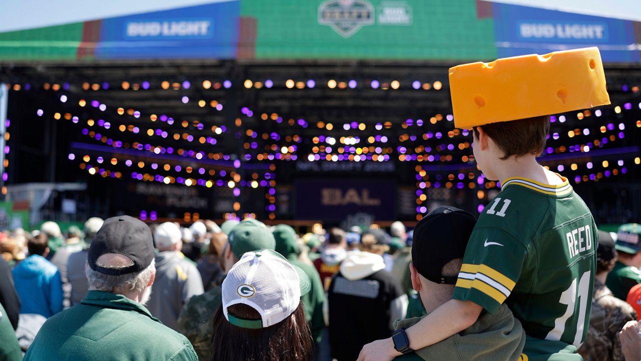 Fans watch during the third day of the NFL football draft, Saturday, April 26, 2025, in Green Bay, Wis.