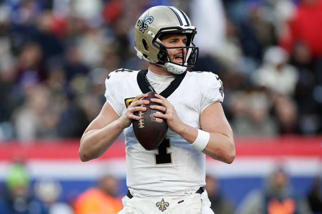 New Orleans Saints quarterback Derek Carr (4) looks to pass the ball during an NFL football game against the New York Giants, Dec. 8, 2024, in East Rutherford, N.J. 