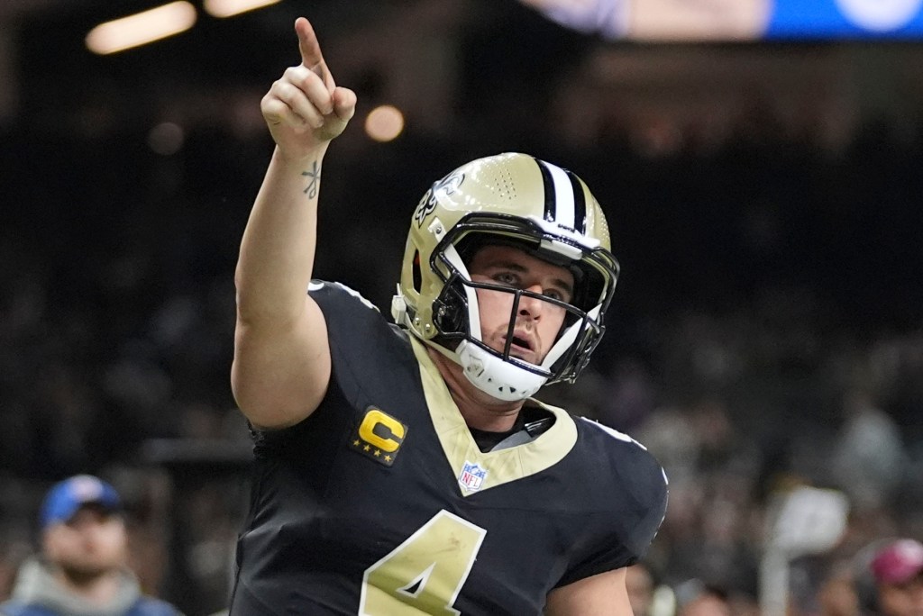 New Orleans Saints quarterback Derek Carr (4) reacts after his first down carry in the second half of an NFL football game against the Los Angeles Rams in New Orleans, Sunday, Dec. 1, 2024. 
