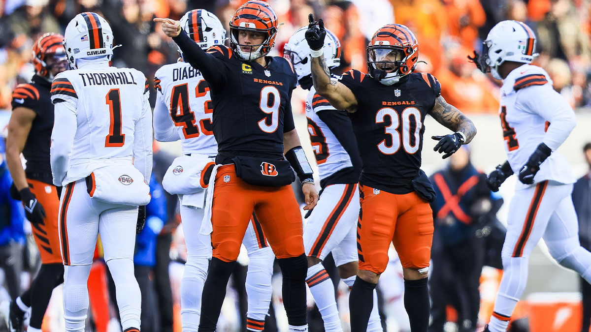 Cincinnati Bengals quarterback Joe Burrow (9) reacts after advancing the ball with running back Chase Brown (30) in the first half against the Cleveland Browns at Paycor Stadium.