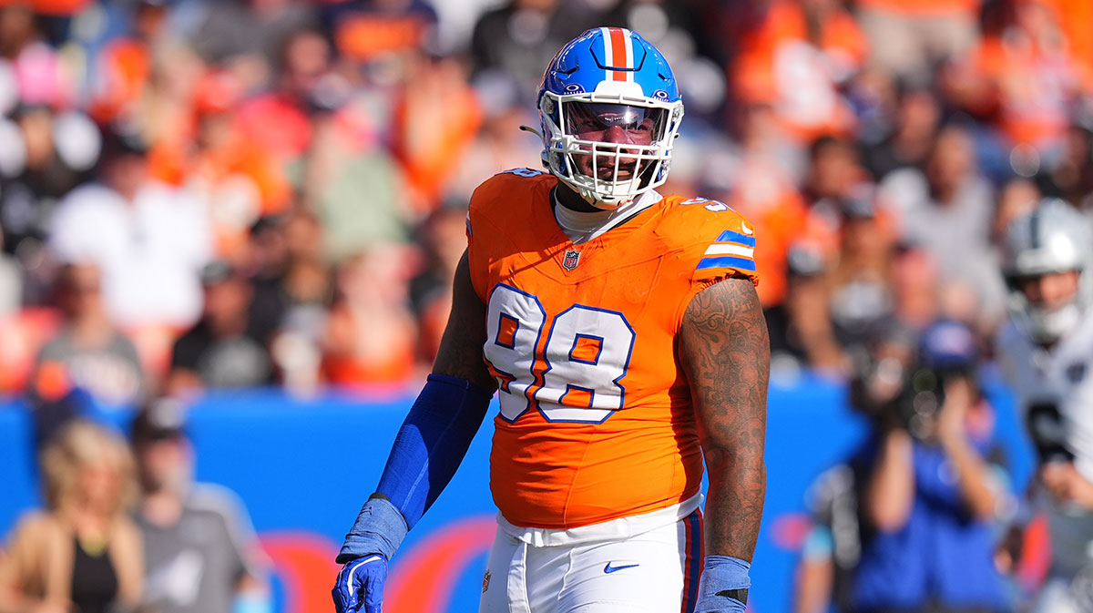 Denver Broncos defensive end John Franklin-Myers (98) reacts to a defensive stop in the second half against the Las Vegas Raiders at Empower Field at Mile High.