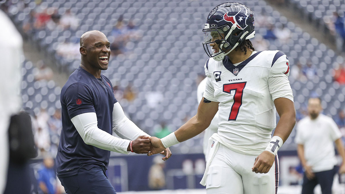 Houston Texans head coach DeMeco Ryans shakes hands with quarterback C.J. Stroud (7) before the game against the Indianapolis Colts at NRG Stadium.