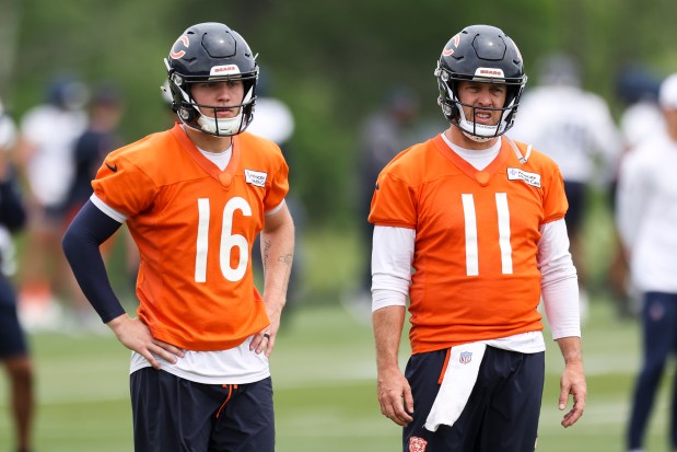 Bears quarterbacks Austin Reed (16) and Case Keenum (11) stand on the field during practice at Halas Hall on Tuesday, June 3, 2025. (Eileen T. Meslar/Chicago Tribune)