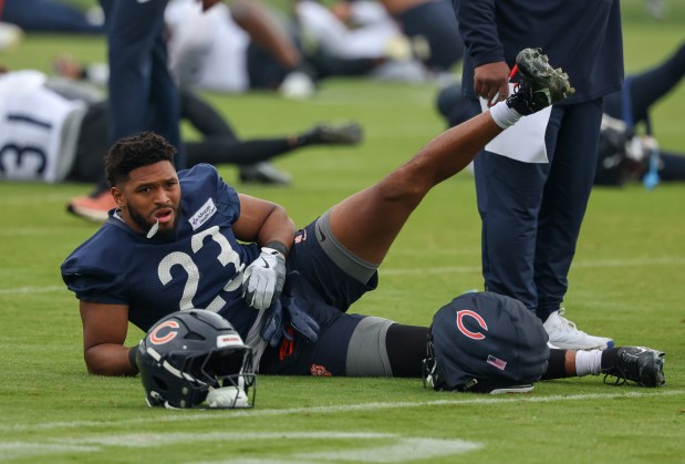 Running back Roschon Johnson stretches during Bears minicamp at Halas Hall on June 4, 2025, in Lake Forest. (Stacey Wescott/Chicago Tribune)
