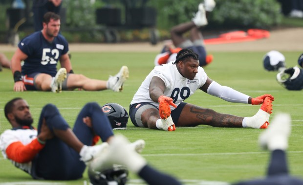 Defensive tackle Gervon Dexter Sr. (99) stretches during Bears minicamp at Halas Hall on June 4, 2025, in Lake Forest. (Stacey Wescott/Chicago Tribune)