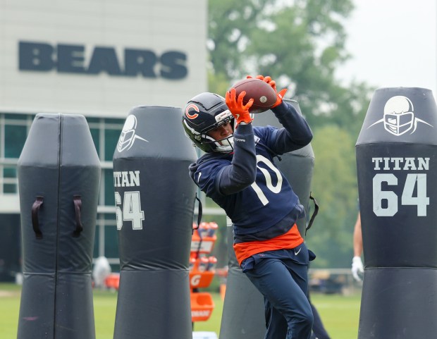 Wide receiver Tyler Scott catches the ball and turns upfield during Bears minicamp at Halas Hall on June 4, 2025, in Lake Forest. (Stacey Wescott/Chicago Tribune)