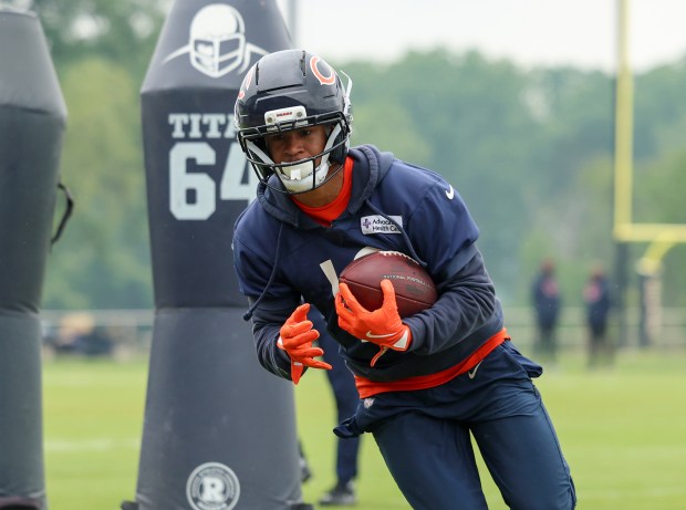 Wide receiver Tyler Scott catches the ball and turns upfield during Bears minicamp at Halas Hall on June 4, 2025, in Lake Forest. (Stacey Wescott/Chicago Tribune)