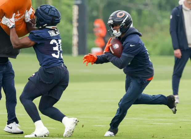 Wide receiver Tyler Scott catches the ball and turns upfield during Bears minicamp at Halas Hall on June 4, 2025, in Lake Forest. (Stacey Wescott/Chicago Tribune)