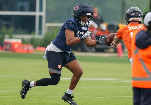 Running back Roschon Johnson runs the ball during Bears minicamp at Halas Hall on June 4, 2025, in Lake Forest. (Stacey Wescott/Chicago Tribune)