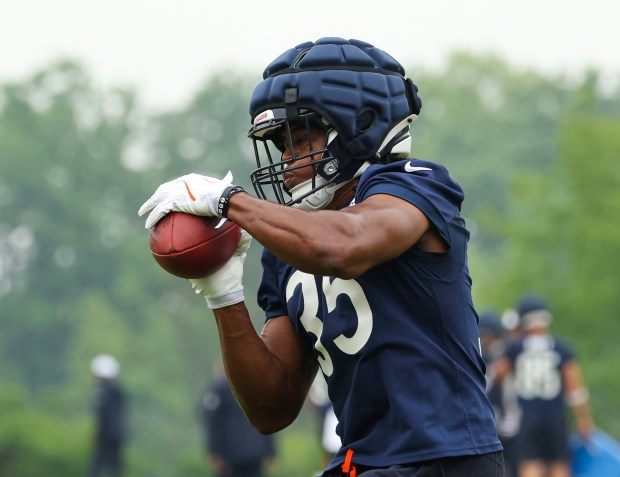 Running back Deion Hankins catches the ball and turns upfield during Bears minicamp at Halas Hall on June 4, 2025, in Lake Forest. (Stacey Wescott/Chicago Tribune)