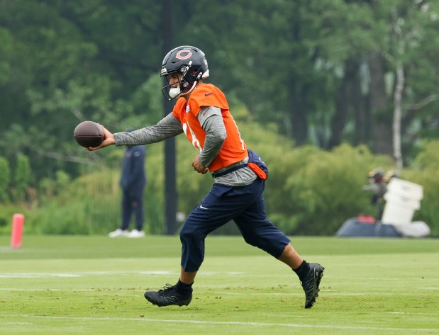 Quarterback Caleb Williams runs through drills during Bears minicamp at Halas Hall on June 4, 2025, in Lake Forest. (Stacey Wescott/Chicago Tribune)