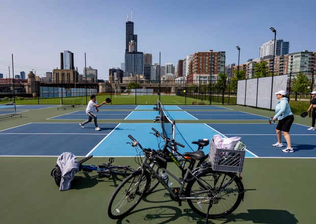 People play pickleball on new courts inside The 78 on...