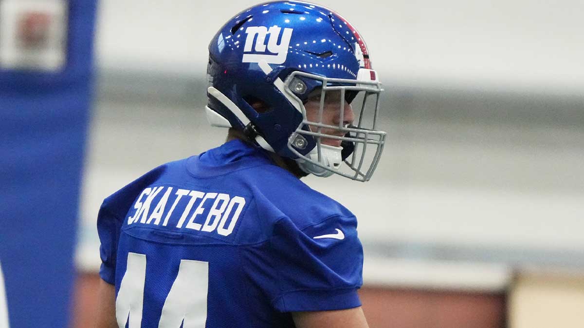 Running back Cam Skattebo during warm up drills.