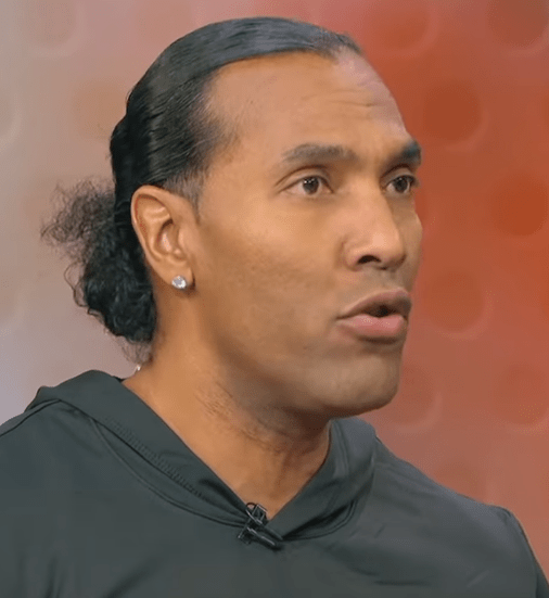 Close-up of a man speaking.