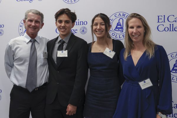 (L-R) Dean Lofgren, former El Camino College track and field coach, Alan Canales, ECC track and field and cross country member, Arianna Hurtado, ECC track and field and cross country member, and Kirsten Green, ECC cross country coach, celebrate during the 2025 Athletics Hall of Fame ceremony in the Gymnasium on Thursday, May 29. Canales and Hurtado were recipients of the Dave Shannon Honorary Scholarship for their academic and athletic success. (Eddy Cermeno | The Union)