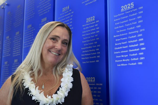Kristi Copeland, El Camino College Athletic Hall of Fame inductee, stands next to the 