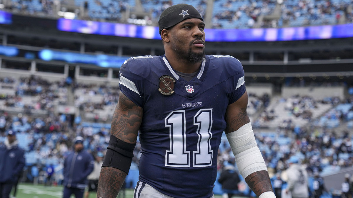 Dallas Cowboys linebacker Micah Parsons (11) walks onto the field during the first quarter against the Carolina Panthers at Bank of America Stadium.