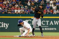 Pittsburgh Pirates shortstop Oneil Cruz (15) throws to first for a double play after tagging...