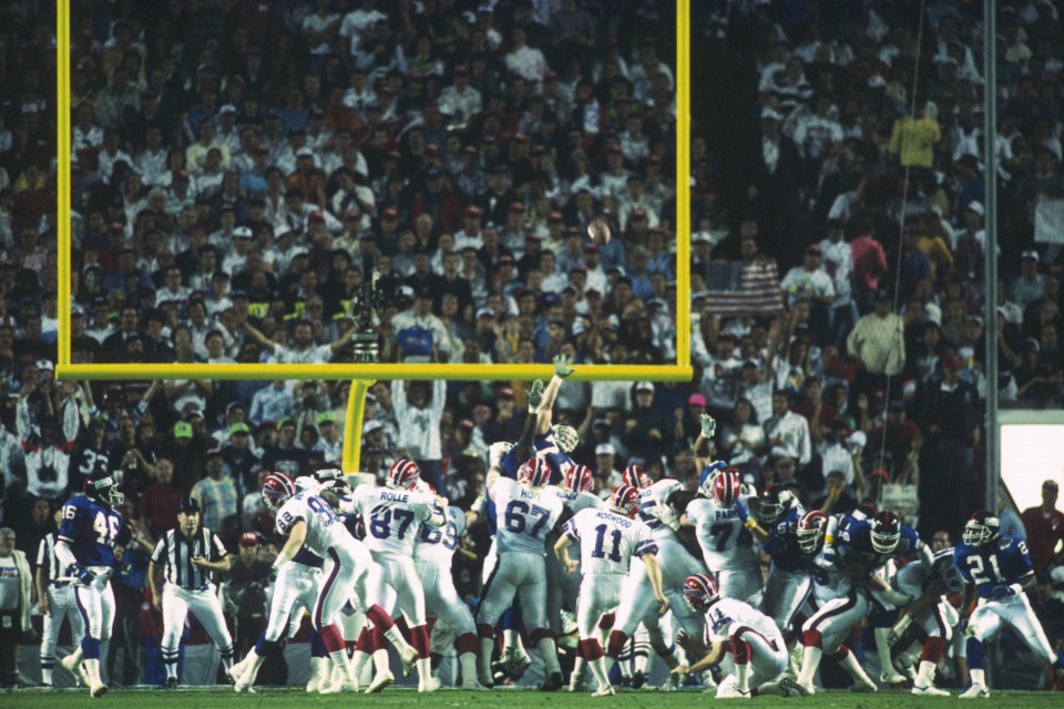 TAMPA, FL - JANUARY 27: Kicker Scott Norwood #11 of the Buffalo Bills kicks near the end zone during Super Bowl XXVI against the New York Giants at Tampa Stadium on January 27, 1991 in Tampa, Florida. The Giants defeated the Bills 20-19. (Photo by Focus on Sport via Getty Images)
