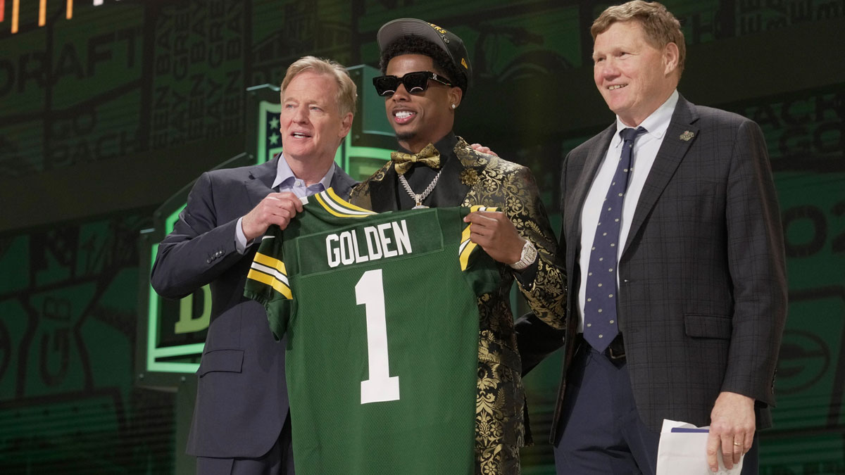 Wide Receiver Matthew Golden of Texas poses with NFL Commissioner Roger Goodell and President and CEO of the Green Bay Packers Mark Murphy after being selected twenty-third overall pick by the Green Bay Packers during the first round of the 2025 NFL Draft at Lambeau Field on April 24, 2025 in Green Bay.