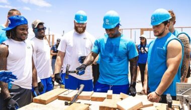 Los Angeles Rams rookies, including linebacker Chris Paul Jr., with hammer, worked on rebuilding a Lahaina home in a partnership with Habitat for Humanity Maui on Tuesday.