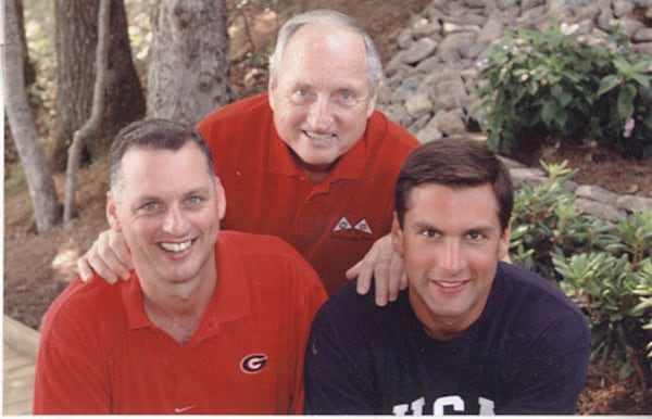 Derek Dooley (right, with older brother Daniel, left, and dad Vince in 2003) played college football at Virginia and high school football at Clarke Central.
