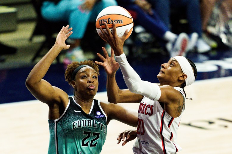 The Washington Mystics' Brittney Sykes (right) goes up for a layup during a WNBA matchup between the Mystics and the New York Liberty on May 30, 2025, at CareFirst Arena in Washington, D.C. (Marcus Relacion/The Washington Informer)