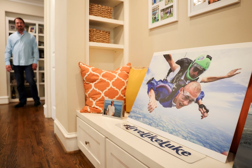 Former Dallas Cowboys quarterback and CBS 11 sports anchor Babe Laufenberg passes by a photo...