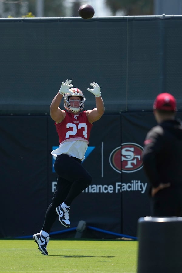 San Francisco 49ers running back Christian McCaffrey (23) catches a pass during practice at NFL football minicamp Wednesday, June 11, 2025, in Santa Clara, Calif. (AP Photo/Jeff Chiu)