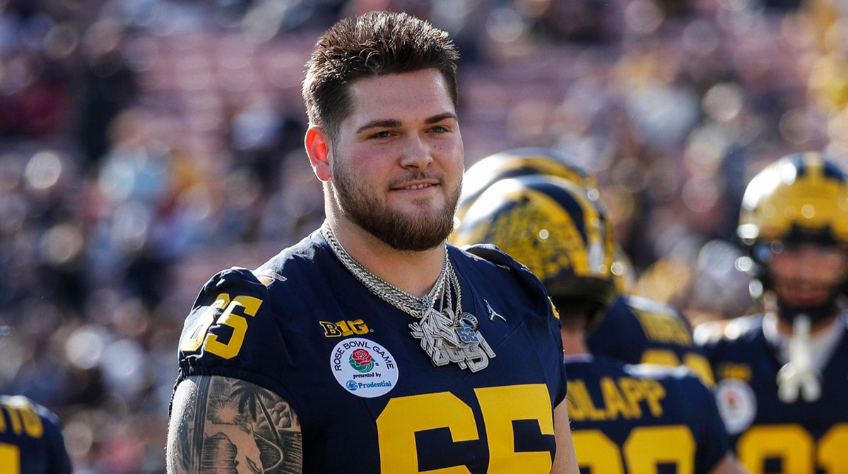 Michigan offensive lineman Zak Zinter (65) watches warm up ahead of the Rose Bowl game against Alabama at Rose Bowl Stadium in Pasadena, Calif., on Monday, Jan. 1, 2024.