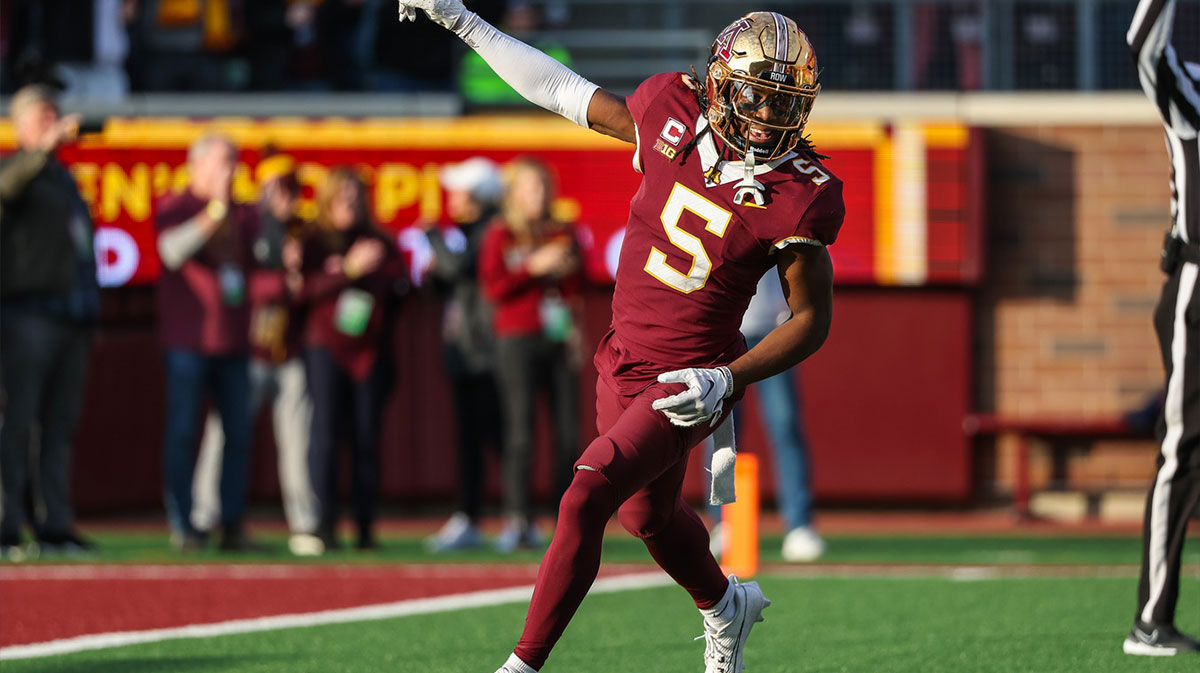 Minnesota Golden Gophers defensive back Justin Walley (5) celebrates a fumble recovery by defensive lineman Chris Collins (13) during the second half against the Illinois Fighting Illini at Huntington Bank Stadium.