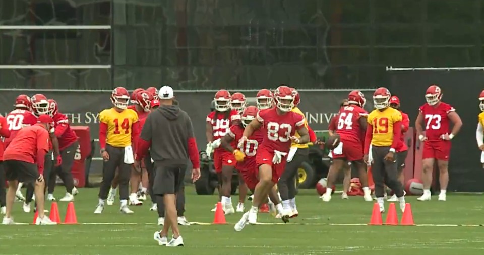Kansas City Chiefs football players practicing on a field.