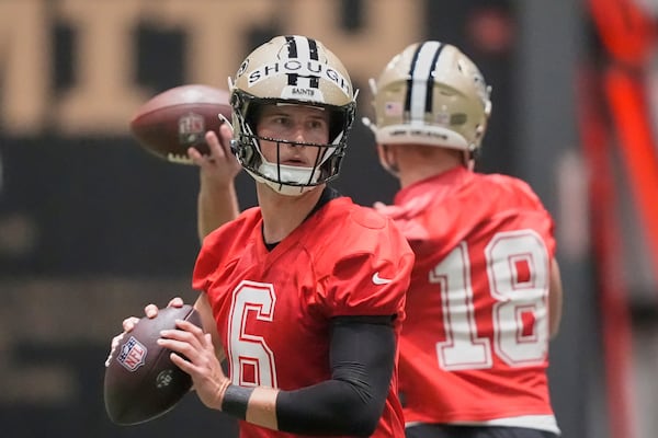New Orleans Saints quarterbacks Tyler Shough (6) and Hunter Dekkers (18) run through drills during the NFL football team's rookie minicamp in Metairie, La., Saturday, May 10, 2025. (AP Photo/Gerald Herbert)