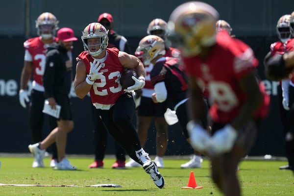 San Francisco 49ers running back Christian McCaffrey (23) runs a drill during practice at NFL football minicamp Tuesday, June 10, 2025, in Santa Clara, Calif. (AP Photo/Jeff Chiu)