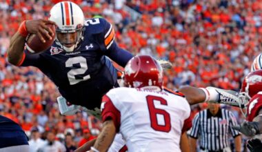 How many former Auburn players are eligible for the College Football Hall of Fame?