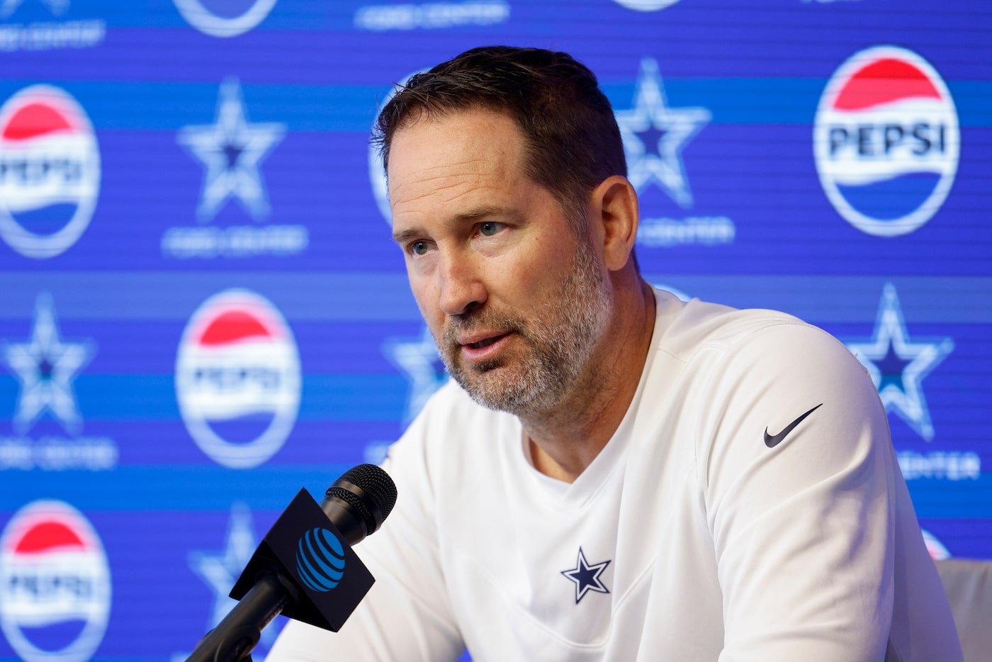 Dallas Cowboys head coach Brian Schottenheimer speaks during a news conference before an OTA...