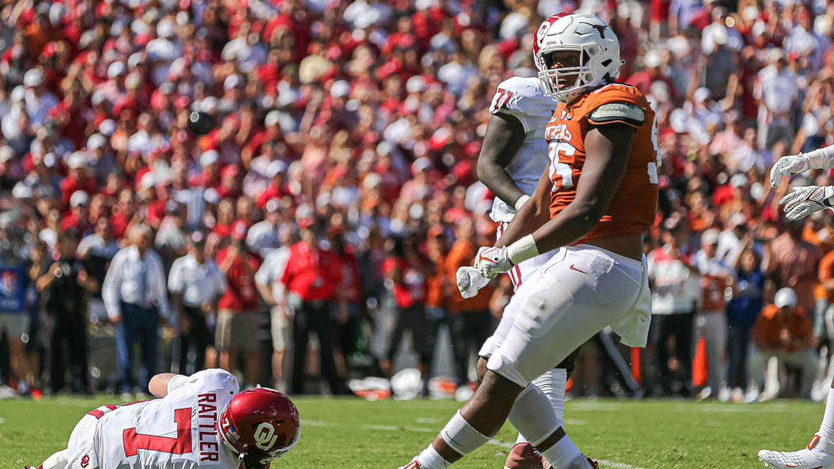 Texas defensive lineman Alfred Collins celebrates a sack. Texas took on Oklahoma in the 2021 Red River Showdown at the Cotton Bowl in Dallas, Texas on Oct. 9, 2021.