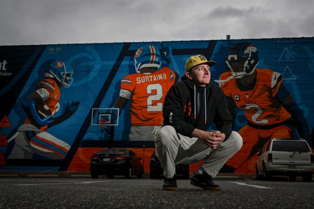Artist Gus Rey poses in front of his recently completed mural of Denver Broncos star Pat Surtain II in downtown Denver on Tuesday, June 3, 2025. (Photo by AAron Ontiveroz/The Denver Post)