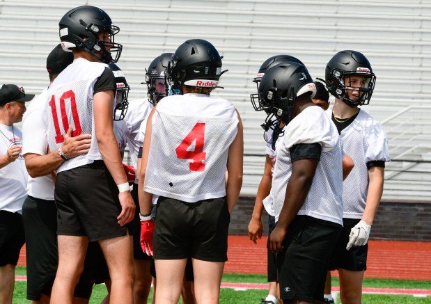 Brookside huddles during a 7-on-7 competition June 16 at Perry. (Steve Hare - For The News-Herald)